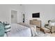 Comfortable bedroom with neutral tones and a woven chair beside a chest of drawers at 215 Fell Pt, Daniel Island, SC 29492