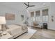 Bright bedroom with natural light, desk, and woven chair, perfect for relaxation at 215 Fell Pt, Daniel Island, SC 29492