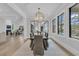 Dining area with large window views, a modern light fixture and seating for six at 215 Fell Pt, Daniel Island, SC 29492