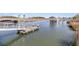 Dock with boat lift over calm waters surrounded by lush greenery and waterfront homes at 215 Fell Pt, Daniel Island, SC 29492