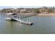 Picturesque view of a private dock and pier extending into tranquil waters, perfect for boating and relaxation at 215 Fell Pt, Daniel Island, SC 29492
