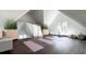 Bright workout room features exercise mats, mirrors and plants in converted attic space at 215 Fell Pt, Daniel Island, SC 29492