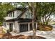 Charming home with a three car garage and inviting driveway entrance at 215 Fell Pt, Daniel Island, SC 29492