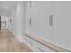 Hallway features custom built-ins with bench and drawer storage and brass hardware at 215 Fell Pt, Daniel Island, SC 29492