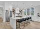 Bright, open kitchen features a large island with seating and stainless steel appliances at 215 Fell Pt, Daniel Island, SC 29492