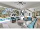 Spacious outdoor patio with comfortable seating, a pool, and views of the beautiful backyard at 215 Fell Pt, Daniel Island, SC 29492