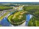 Aerial view of homes along a waterway, lined with green trees and walking trails at 219 Seaworthy St, Summerville, SC 29486