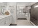 Modern bathroom with double sink vanity, large mirror, and glass shower at 219 Seaworthy St, Summerville, SC 29486
