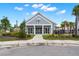 View of the clubhouse exterior, landscaping and walkway at 219 Seaworthy St, Summerville, SC 29486