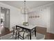 Elegant dining room with hardwood floors, decorative light fixture, and white trim at 219 Seaworthy St, Summerville, SC 29486