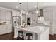 Modern kitchen featuring an island with seating, stainless steel appliances, and ample cabinet space at 219 Seaworthy St, Summerville, SC 29486