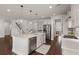 Bright and airy kitchen featuring a large island, stainless steel appliances, and hardwood floors at 219 Seaworthy St, Summerville, SC 29486