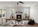 Cozy living room with a fireplace, hardwood floors, and comfortable seating arrangement at 219 Seaworthy St, Summerville, SC 29486