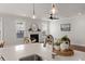 Kitchen island sink detail, open view to living room with fireplace and dining area at 219 Seaworthy St, Summerville, SC 29486