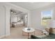 Bright main bedroom features a comfortable sitting area with plentiful windows at 219 Seaworthy St, Summerville, SC 29486