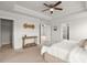 Bright main bedroom features a ceiling fan and a console table with natural light at 219 Seaworthy St, Summerville, SC 29486