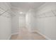 Spacious walk-in closet with ample shelving and carpet flooring at 219 Seaworthy St, Summerville, SC 29486