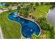 Aerial view of a grand water feature with a decorative fountain, lush greenery, and tranquil water at 219 Seaworthy St, Summerville, SC 29486