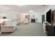 Open basement featuring fireplace, TV and comfortable seating for entertainment at 2217 Beckenham Dr, Mount Pleasant, SC 29466