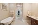 Elegant bathroom showcasing a soaking tub, vanity with marble countertop and a walk-in closet at 2217 Beckenham Dr, Mount Pleasant, SC 29466