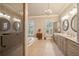Bright bathroom with double vanity, soaking tub, tiled shower and natural light at 2217 Beckenham Dr, Mount Pleasant, SC 29466
