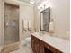 Bathroom with a glass shower, vanity with marble countertop, and decorative mirror at 2217 Beckenham Dr, Mount Pleasant, SC 29466