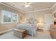 A bright bedroom includes a four-poster bed, neutral walls, and soft bedding at 2217 Beckenham Dr, Mount Pleasant, SC 29466