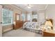 Bedroom featuring windows with shades, light neutral walls, and wooden dresser at 2217 Beckenham Dr, Mount Pleasant, SC 29466