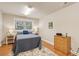 Cozy bedroom featuring wood floors, ample lighting, and a comfortable bed at 2217 Beckenham Dr, Mount Pleasant, SC 29466
