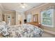 Bedroom with an adjoining bathroom, and a wooden dresser with a mirror at 2217 Beckenham Dr, Mount Pleasant, SC 29466