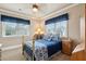 Bedroom with natural light, gold bed frame, blue bedding, and classic furnishings at 2217 Beckenham Dr, Mount Pleasant, SC 29466