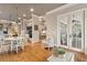 Breakfast area flows into sunroom; open to kitchen and features hardwood floors and white trim at 2217 Beckenham Dr, Mount Pleasant, SC 29466