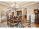 Traditional dining room features a wooden table and chairs, grandfather clock and area rug at 2217 Beckenham Dr, Mount Pleasant, SC 29466