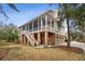 Back of home with screened in porch over looking fenced in yard at 2217 Beckenham Dr, Mount Pleasant, SC 29466