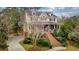 Inviting two-story home with a brick staircase, covered porch, and lush greenery at 2217 Beckenham Dr, Mount Pleasant, SC 29466