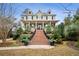 Charming two-story home with a welcoming front porch and manicured landscaping at 2217 Beckenham Dr, Mount Pleasant, SC 29466