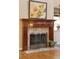 Close-up of a decorative fireplace with custom mantle and tiled hearth at 2217 Beckenham Dr, Mount Pleasant, SC 29466