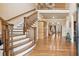 Grand foyer with hardwood floors, staircase, and elegant decor at 2217 Beckenham Dr, Mount Pleasant, SC 29466