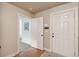 Home entry foyer with hardwood floors, white door, and access to adjacent rooms at 2217 Beckenham Dr, Mount Pleasant, SC 29466