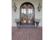 Elegant arched front door with glass panels and decorative planters at 2217 Beckenham Dr, Mount Pleasant, SC 29466