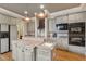 Kitchen island with sink and granite countertop, plus stainless-steel appliances at 2217 Beckenham Dr, Mount Pleasant, SC 29466