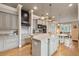 Stylish kitchen island with a sink and stainless steel appliances, in an open concept design at 2217 Beckenham Dr, Mount Pleasant, SC 29466