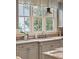 Bright kitchen features a large window over the sink offering natural light and a charming view at 2217 Beckenham Dr, Mount Pleasant, SC 29466