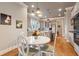 Kitchen and breakfast area with neutral paint, white trim, hardwood floors and breakfast bar at 2217 Beckenham Dr, Mount Pleasant, SC 29466