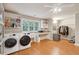 Spacious laundry room with modern washer and dryer and functional storage at 2217 Beckenham Dr, Mount Pleasant, SC 29466