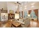 Cozy living room featuring fireplace with decorative mantle and plenty of natural light at 2217 Beckenham Dr, Mount Pleasant, SC 29466