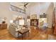 Bright living room with soaring ceilings, hardwood floors, fireplace, and open staircase to the second floor at 2217 Beckenham Dr, Mount Pleasant, SC 29466