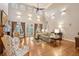Spacious living room with fireplace, cathedral ceiling, hardwood floors, and French doors at 2217 Beckenham Dr, Mount Pleasant, SC 29466