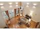 A spacious living room boasts high ceilings, a ceiling fan, and hardwood floors at 2217 Beckenham Dr, Mount Pleasant, SC 29466