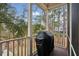 Screened porch with a grill and scenic views of the surrounding greenery at 2217 Beckenham Dr, Mount Pleasant, SC 29466